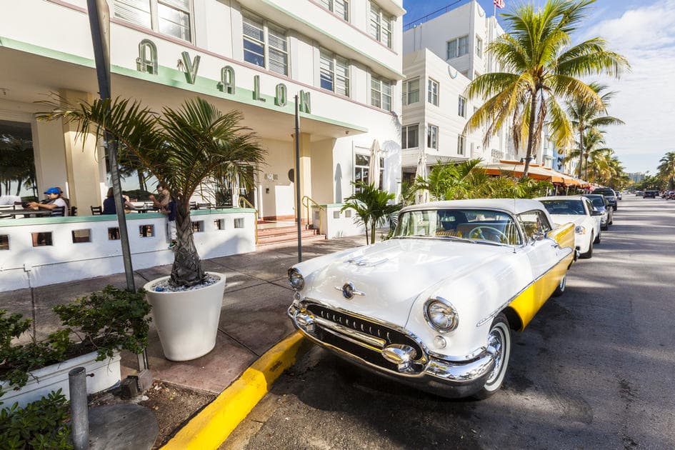 Photo of a parked Cadillac on Ocean Drive in Miami Beach: how to park a car in Miami — American Butler