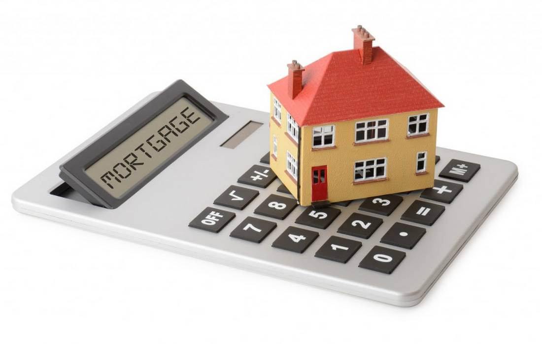 Mortgage USA —  photo of the house on the calculator — American Butler