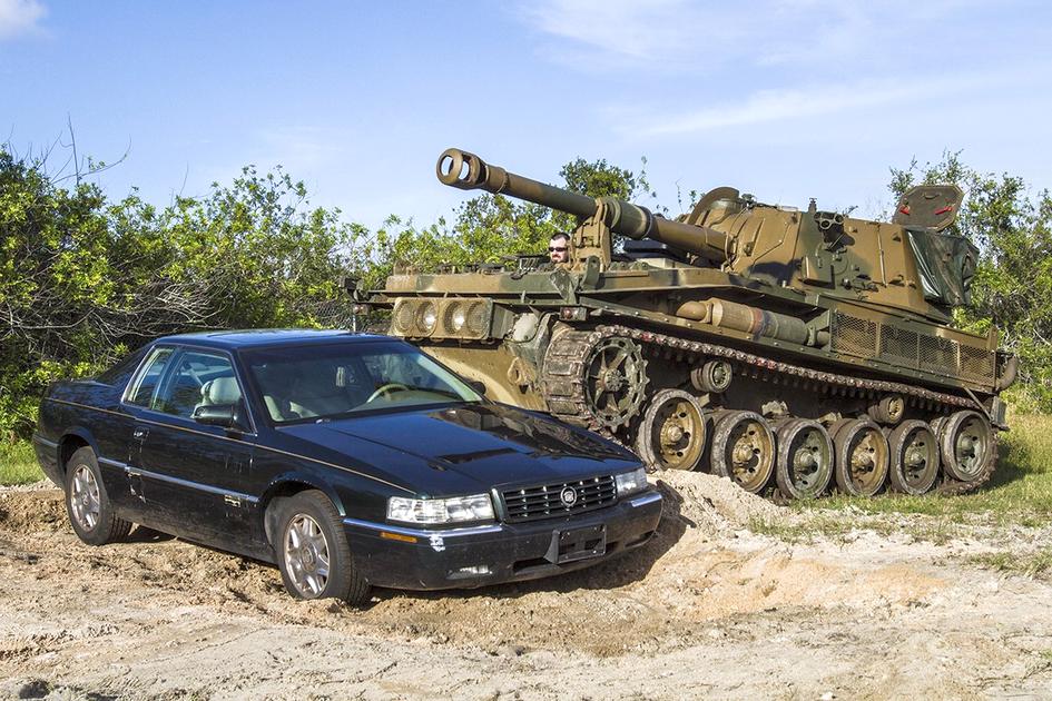 Driving a tank in the USA: drive, push, destroy — photo of a tank running over a car