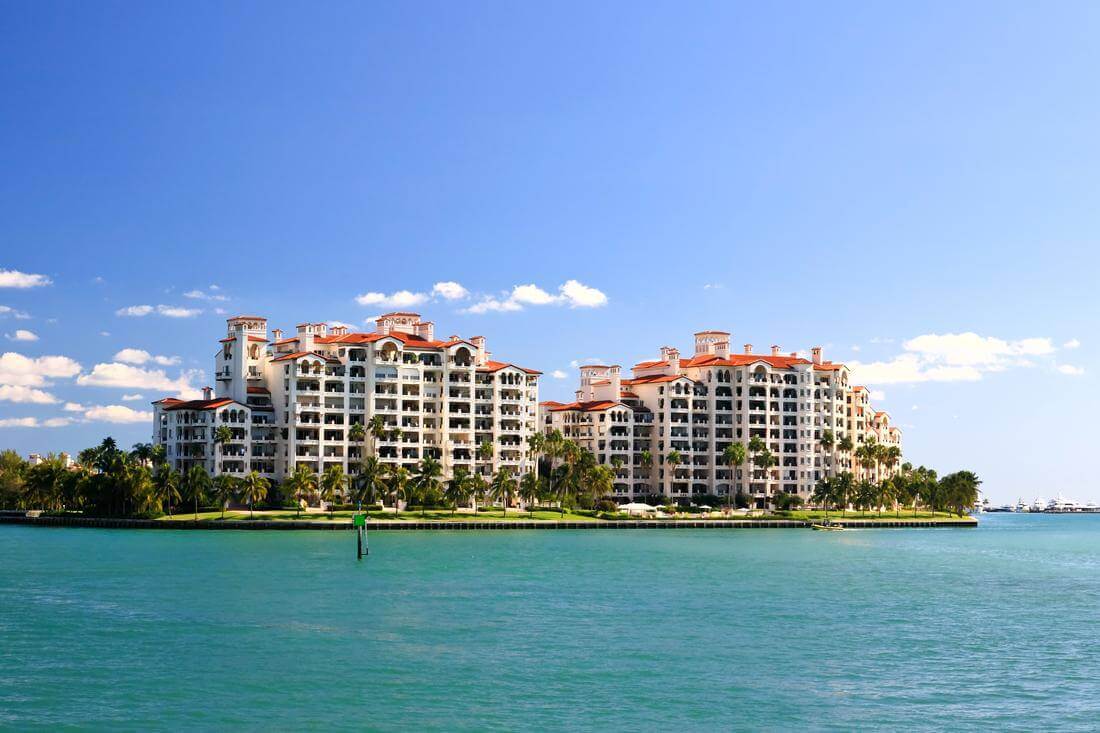 Advantages and disadvantages of buying a property in Miami — photos of residential buildings on Fisher Island — American Butler