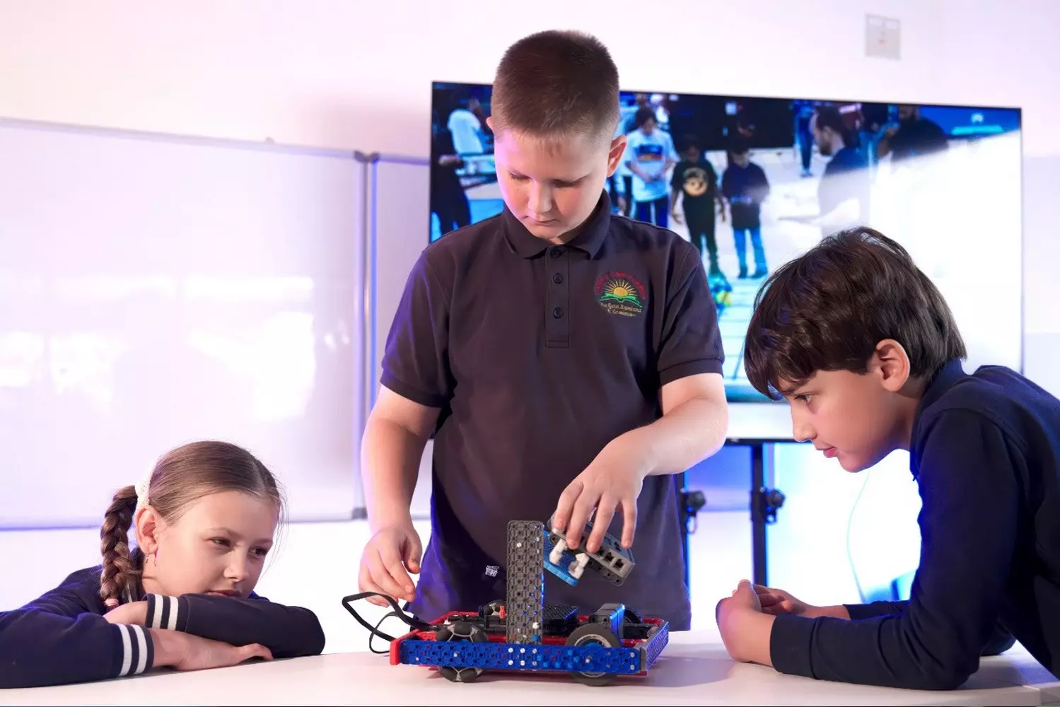 Robotics Class at Sunshine State Academy Elementary School in Miami Elementary school students at Sunshine State Academy in Miami work together to build and program a robot during a hands-on STEM class