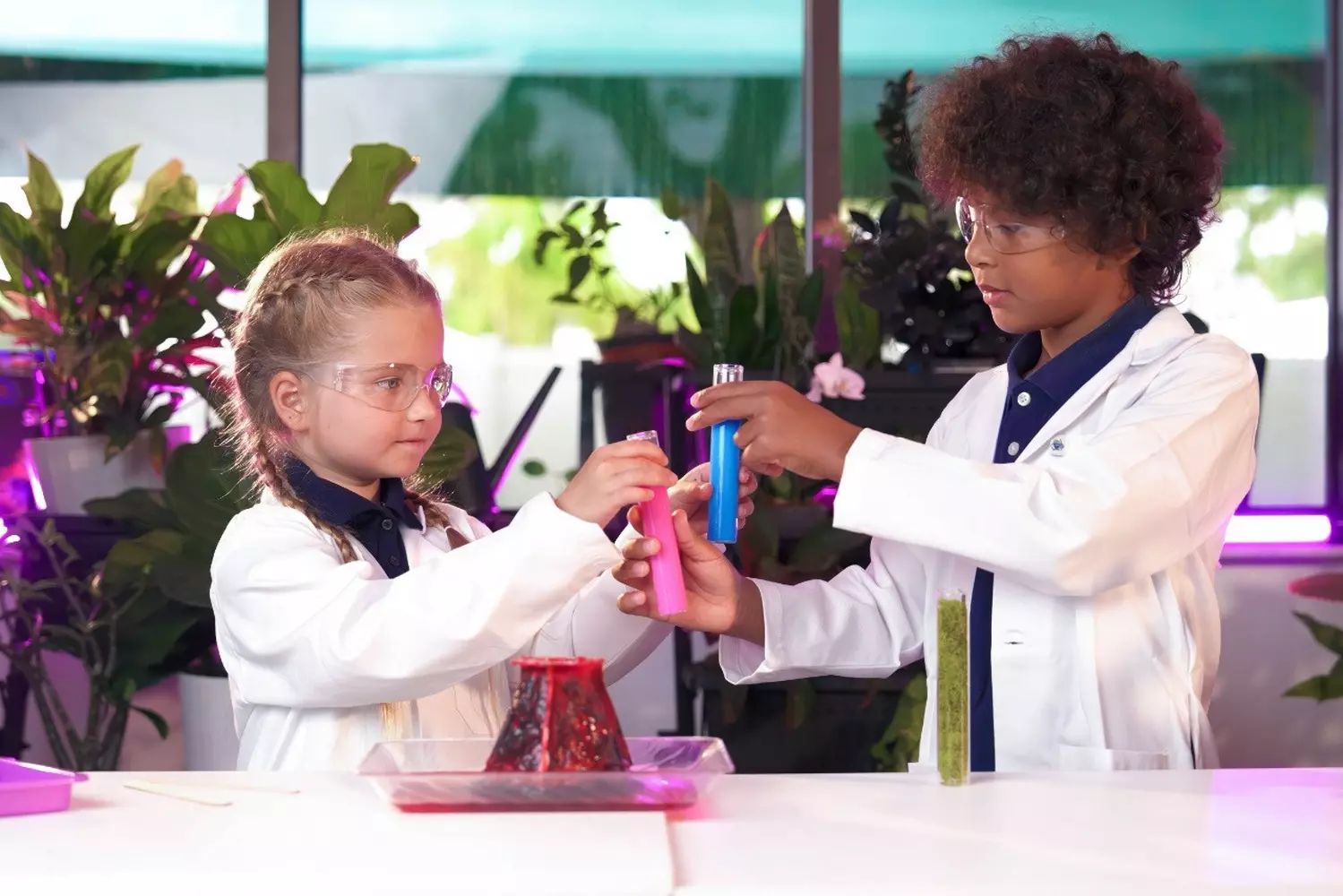 Hands-on Science Experiments at Sunshine State Academy Elementary in Miami Elementary students at Sunshine State Academy in Miami conduct a colorful chemistry experiment with beakers and test tubes, learning scientific methods