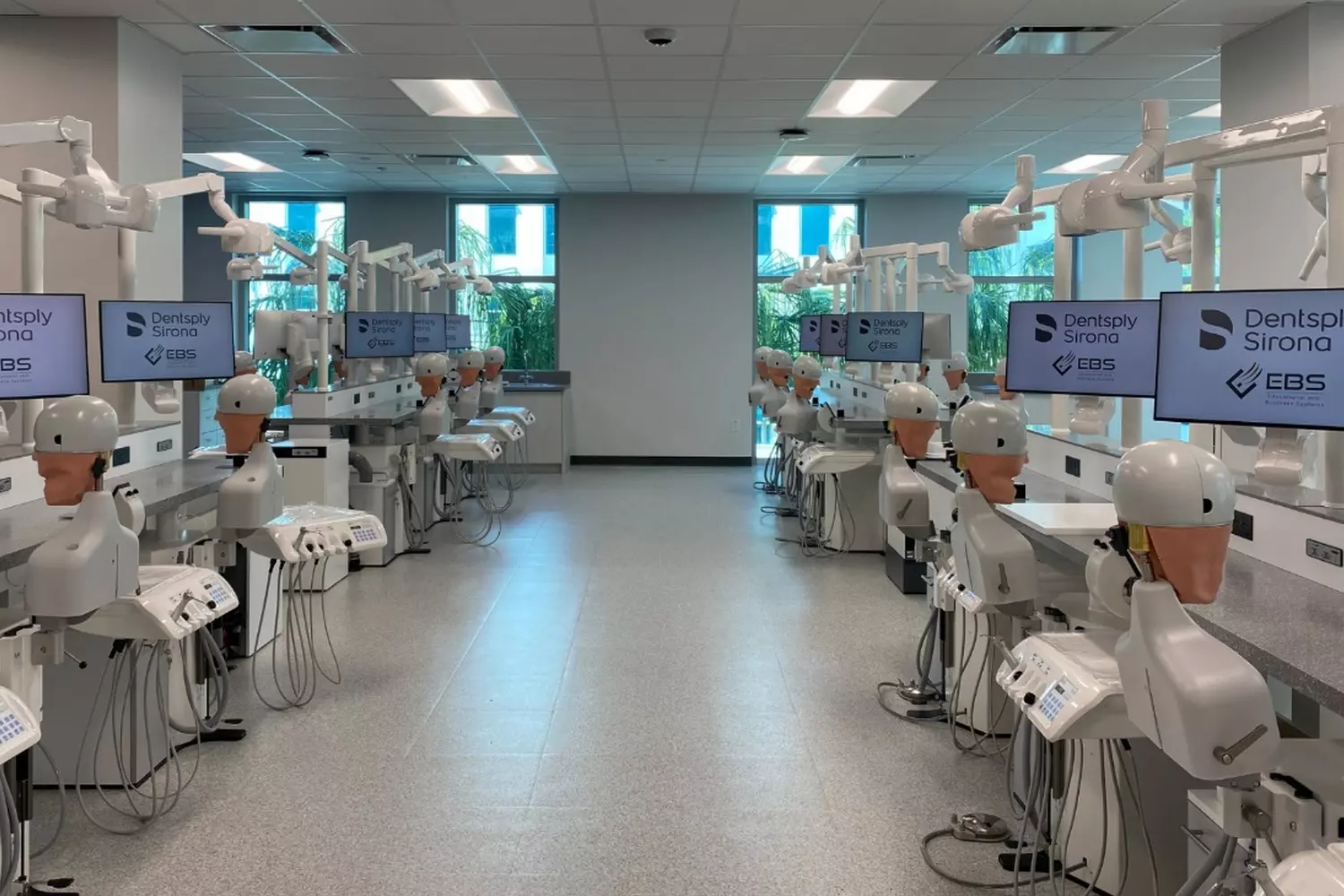 Dental Simulation Lab at Nova Southeastern University Modern dental simulation laboratory at NSU College of Dental Medicine with dental manikins, students practicing procedures, and advanced equipment