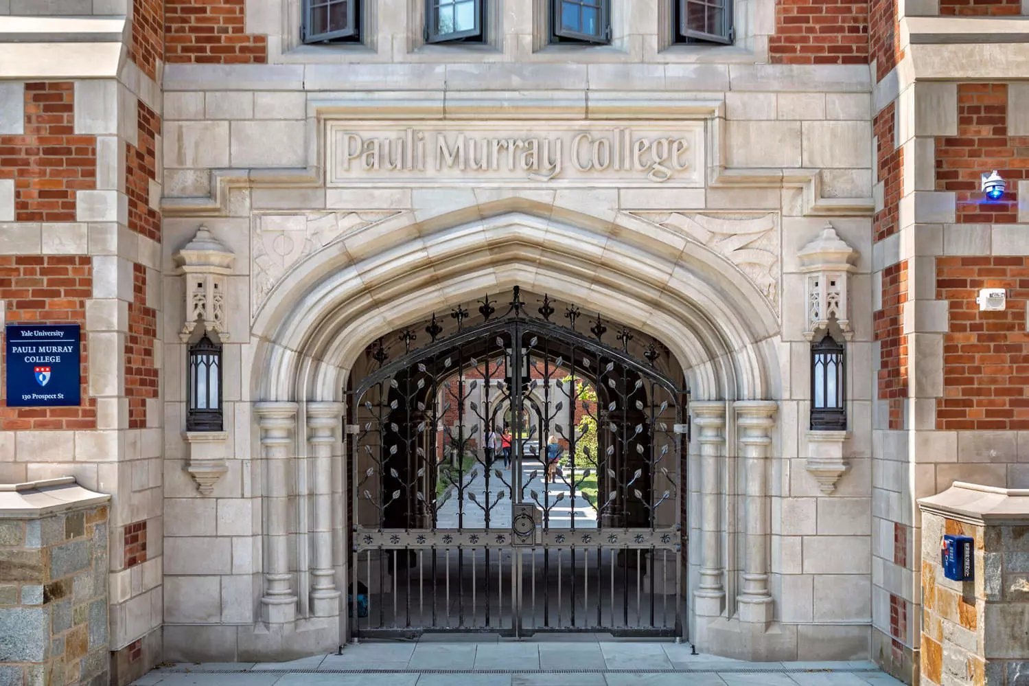 Architectural Heritage of Yale: Gothic Spires of Knowledge Majestic Gothic building of Yale University with a tower and arches on a sunny day