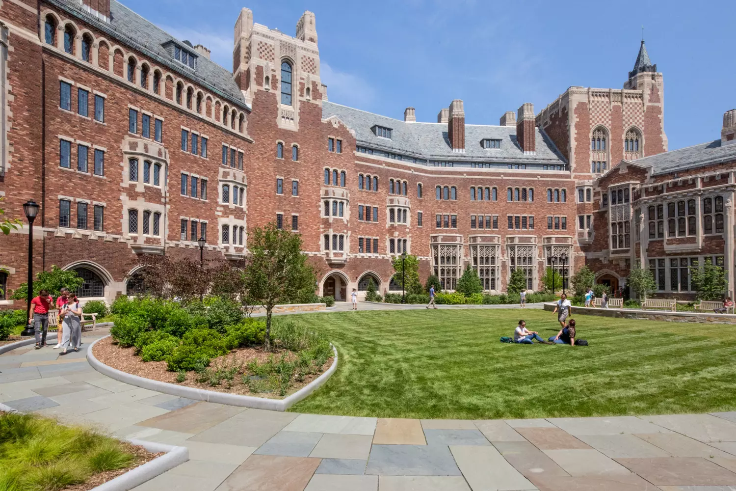 Architectural Heritage of Yale: Gothic Spires of Knowledge Majestic Gothic building of Yale University with a tower and arches on a sunny day