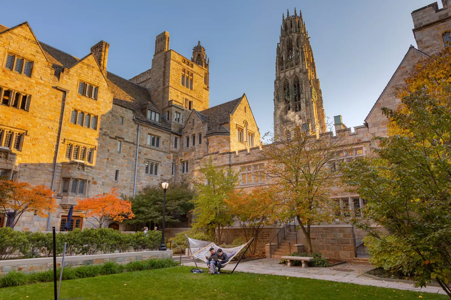 Architectural Heritage of Yale: Gothic Spires of Knowledge Majestic Gothic building of Yale University with a tower and arches on a sunny day