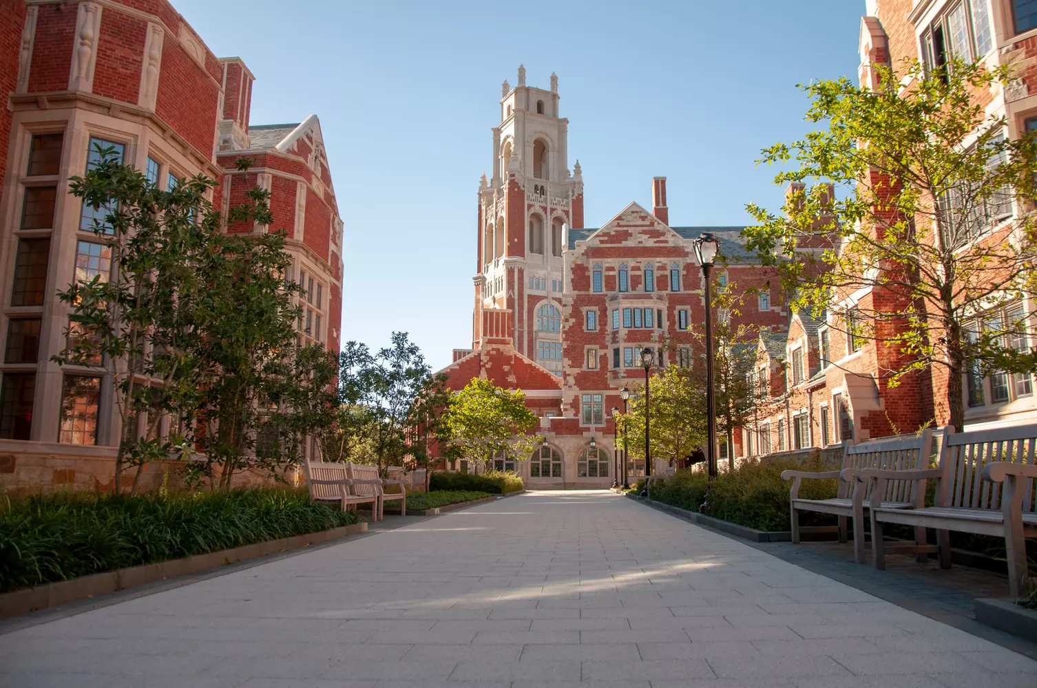 Architectural Heritage of Yale: Gothic Spires of Knowledge Majestic Gothic building of Yale University with a tower and arches on a sunny day