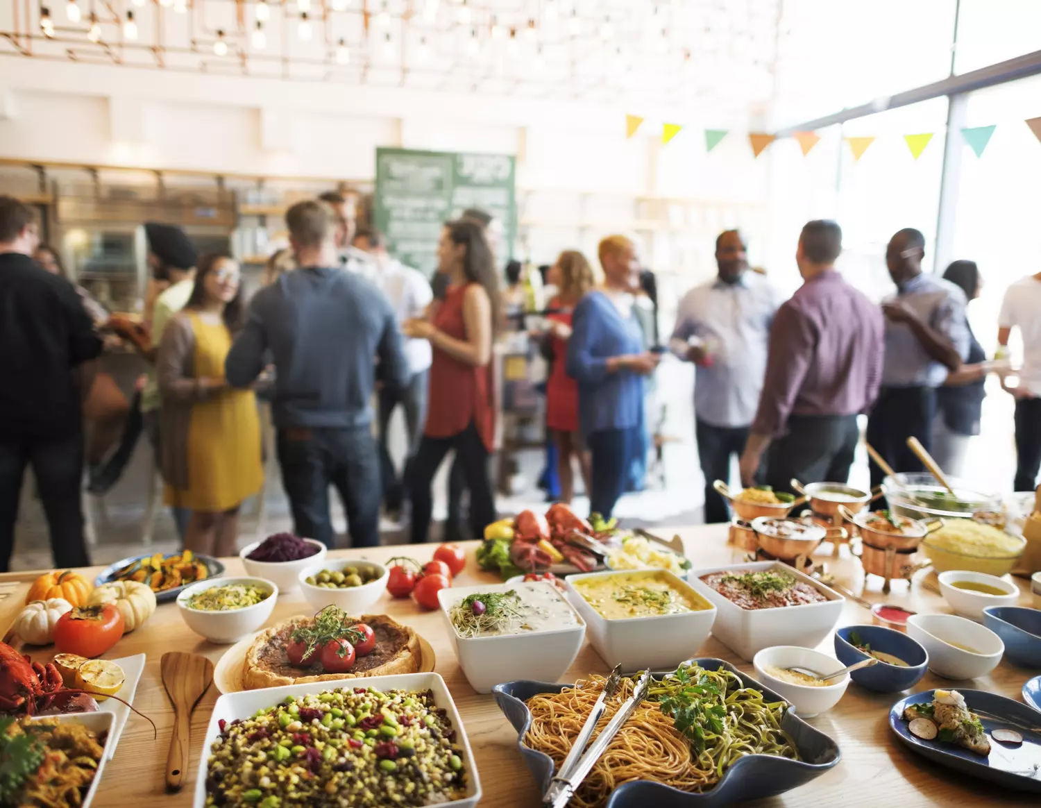 Event planning in Miami — photo of a buffet table and a festive table with food — American Butler