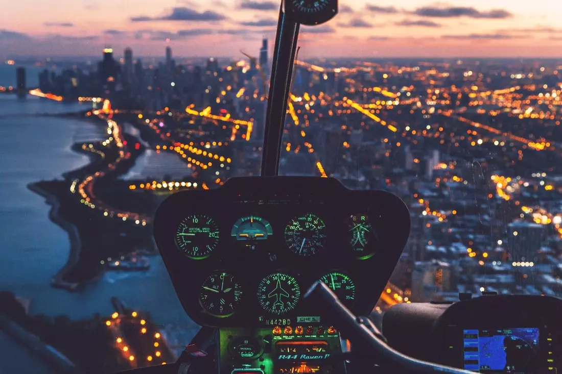 Photo of the inside of a helicopter cockpit on a walk over Chicago