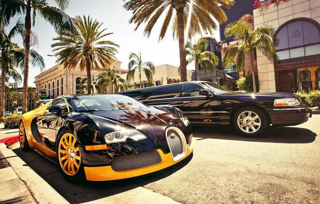 Photo of black Aston Martin on Rodeo Drive in Los Angeles — American Butler