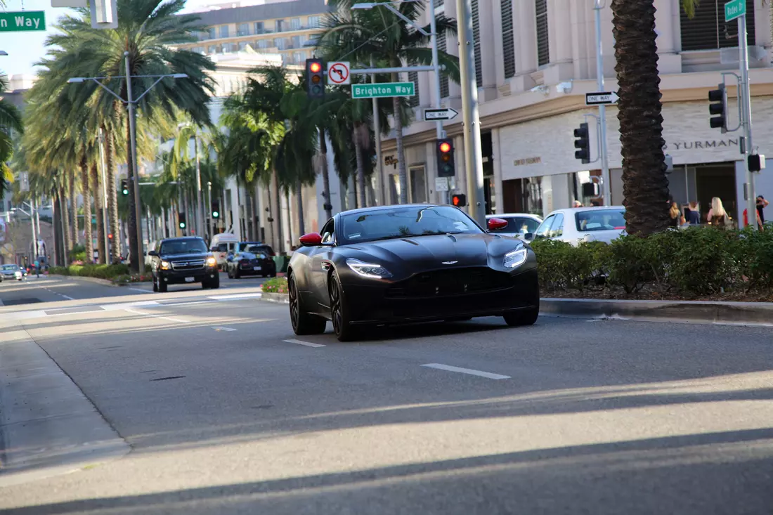 Luxury sports car on Rodeo Drive among high-end shops