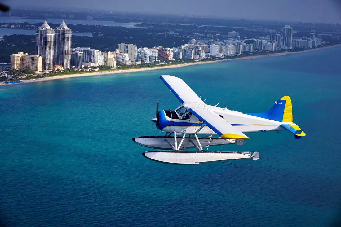 Seaplane at the pier and a view of the romantic hotel from American Butler