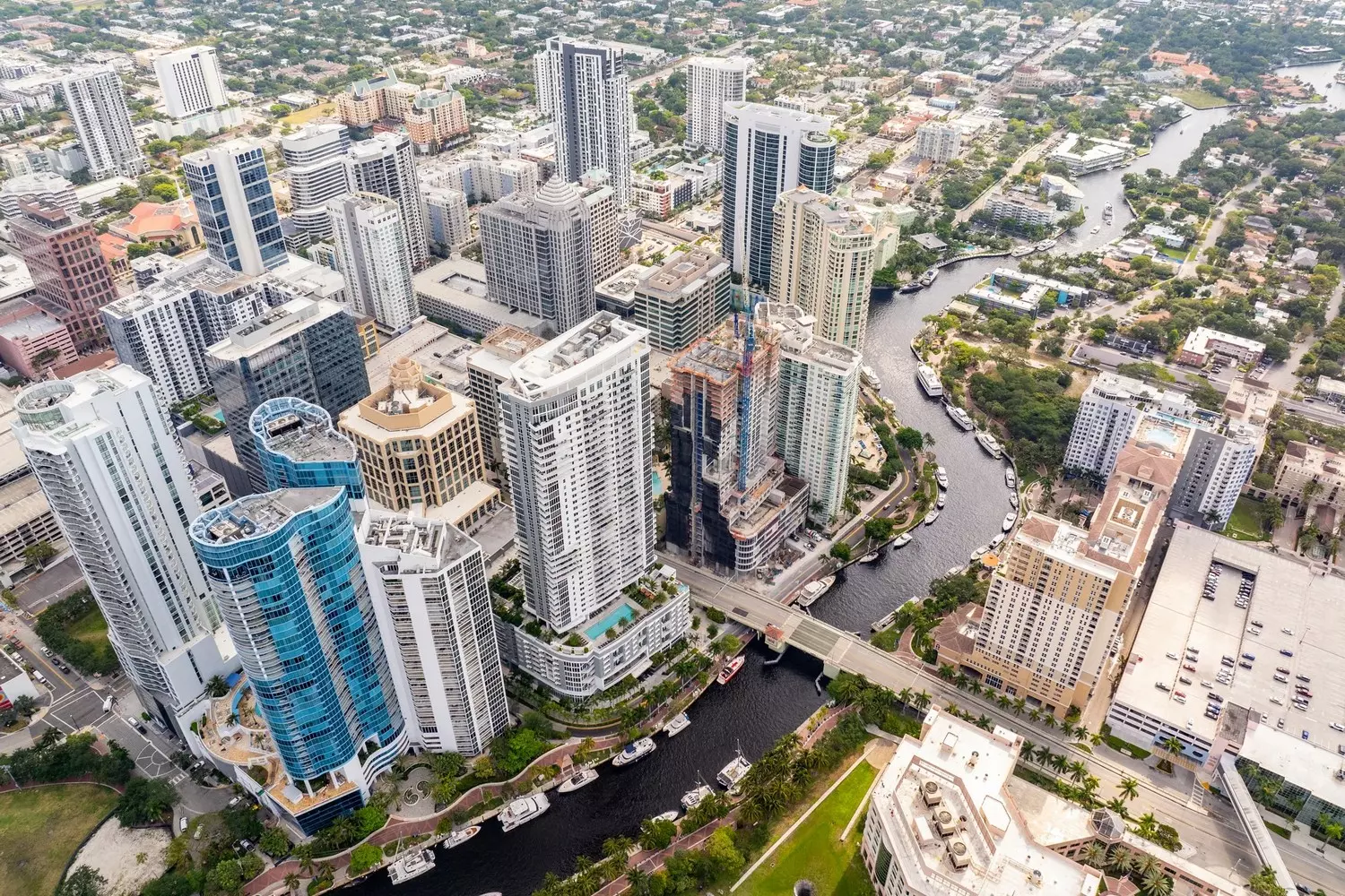 Downtown Fort Lauderdale from Above | Helicopter Aerial View Panoramic aerial view of Downtown Fort Lauderdale from a helicopter, featuring skyscrapers, intercoastal waterways with yachts, and highways near the Atlantic Ocean
