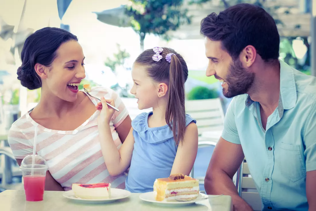 Photo of parents and child in Miami restaurant — American Butler