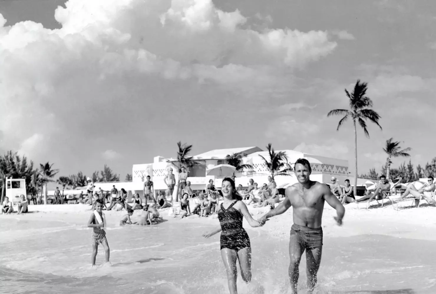 Retro Sarasota Beach – 1950s Florida Coast Nostalgia Vintage Sarasota beach photo with old-fashioned swimsuits and classic cars on Florida's Gulf Coast