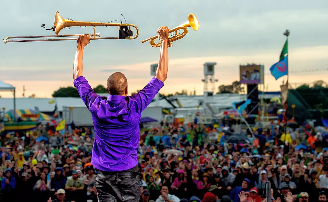 Popular festivals in New Orleans — photo of a musician in front of a crowd — American Butler