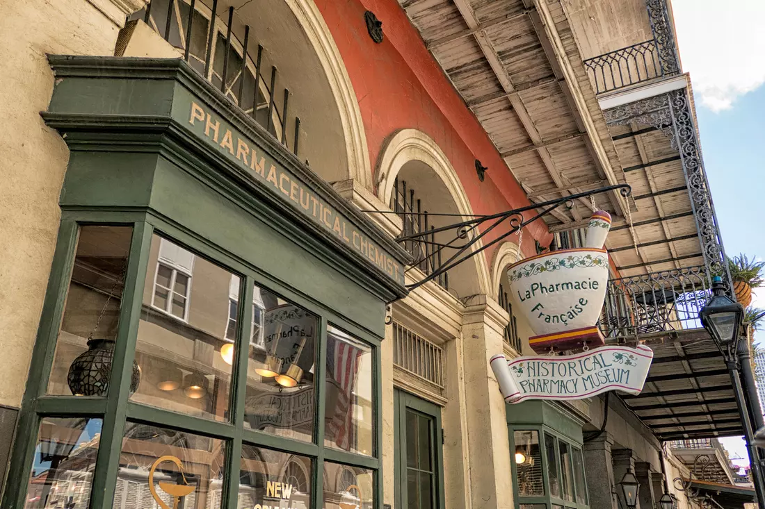 Entrance to the Historical Pharmacy Museum in a French quarter with a vintage sign