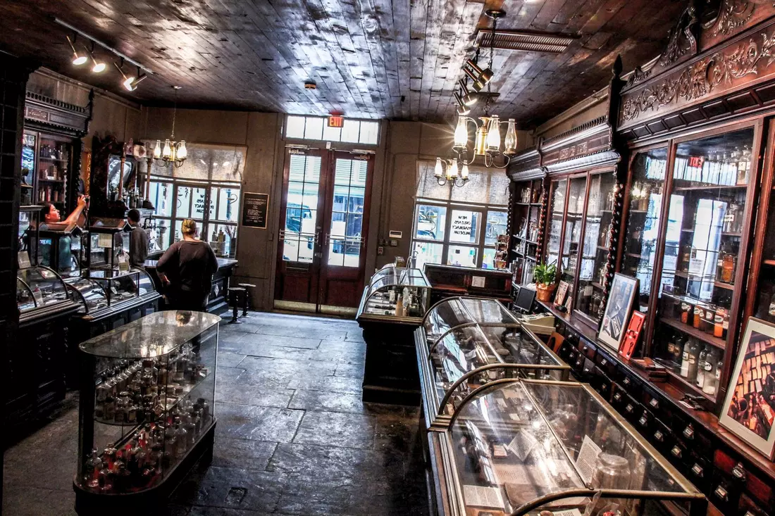 Vintage pharmacy interior with wooden shelves and antique medicine displays