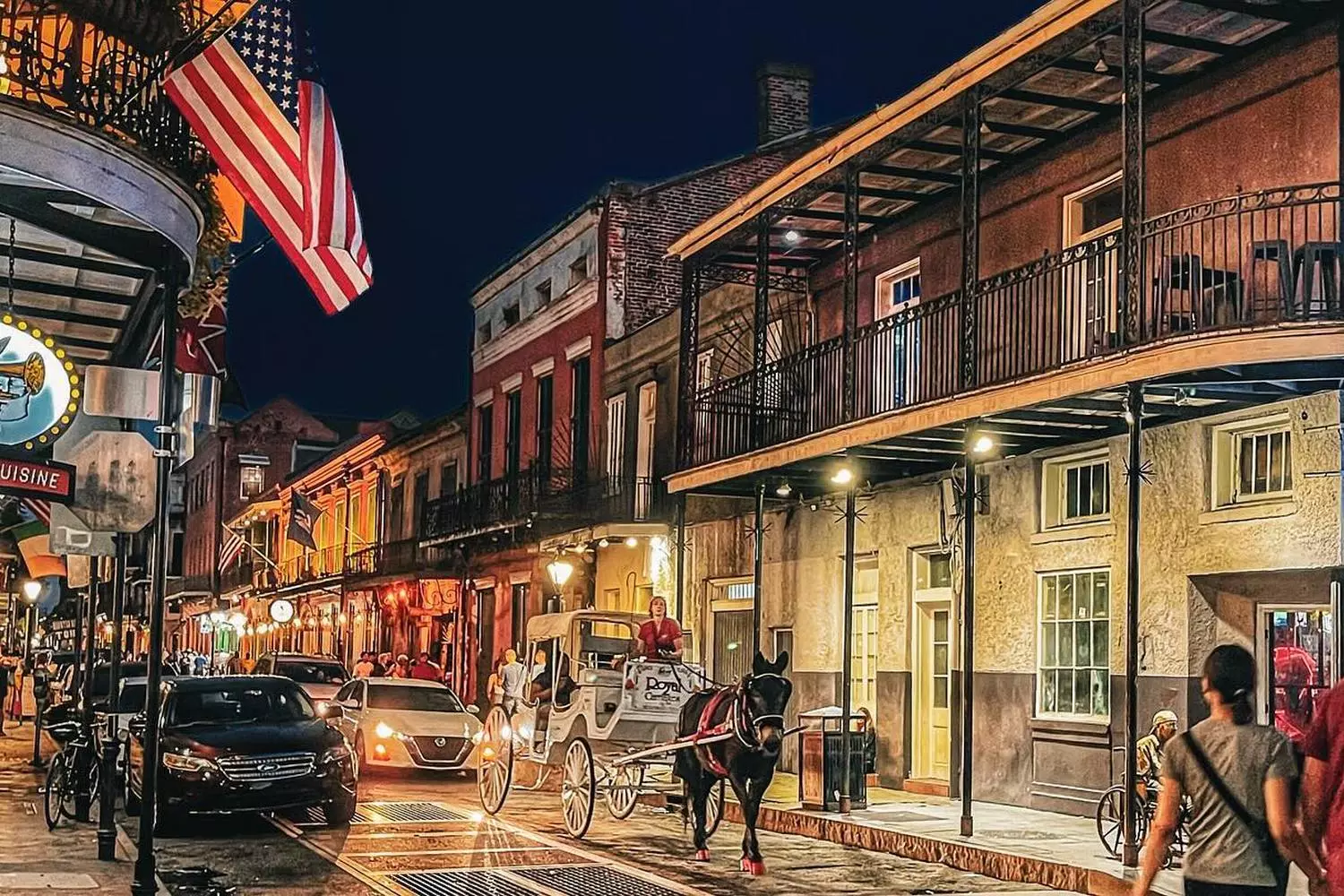New Orleans cityscape at dusk Evening New Orleans, Bourbon Street lights and wrought-iron balconies