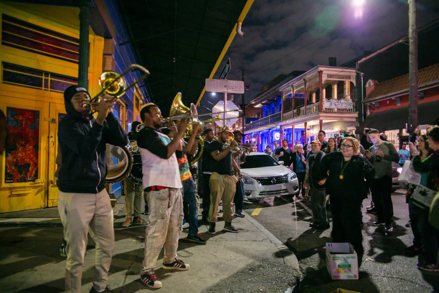 Jazz musicians on Frenchmen Street in evening New Orleans Evening New Orleans, street jazz musicians performing on Frenchmen Street under lantern and neon lights
