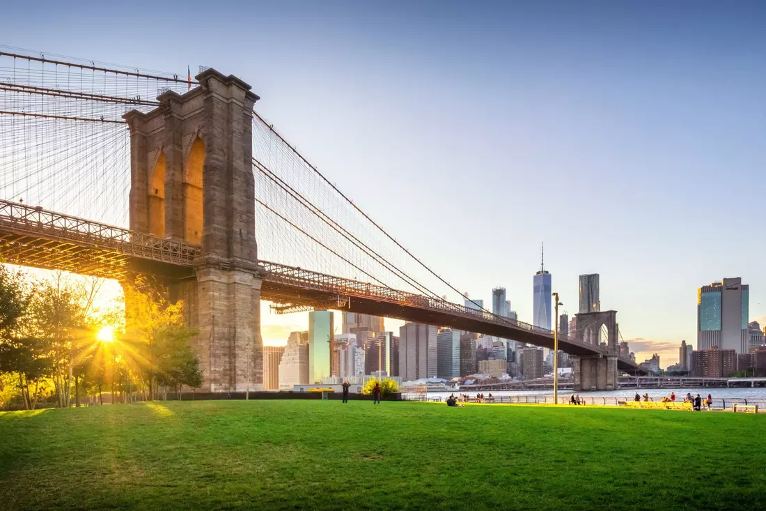 Sunset view of the Brooklyn Bridge with the New York City skyline in the background