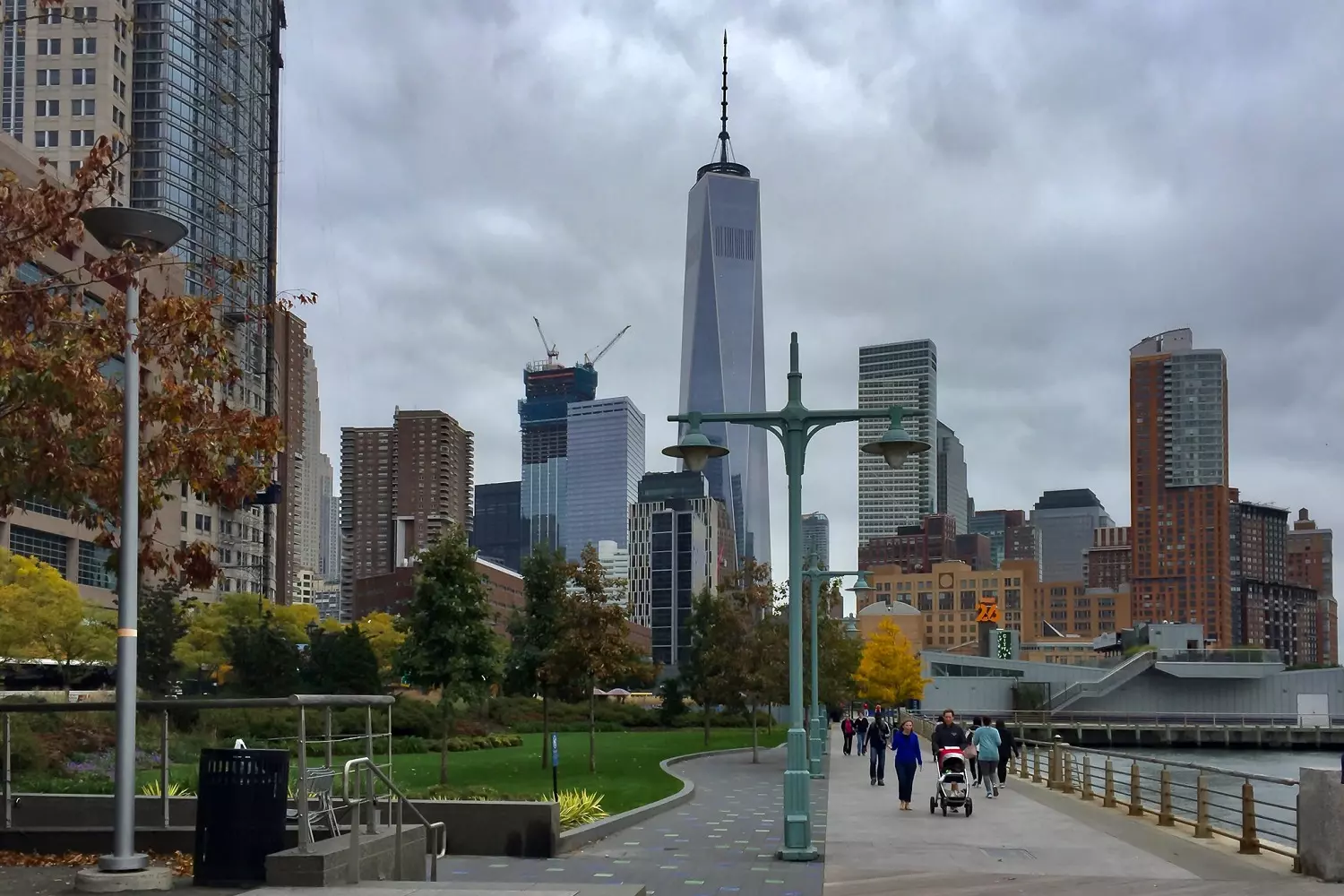 People walk along the path in Hudson River Park