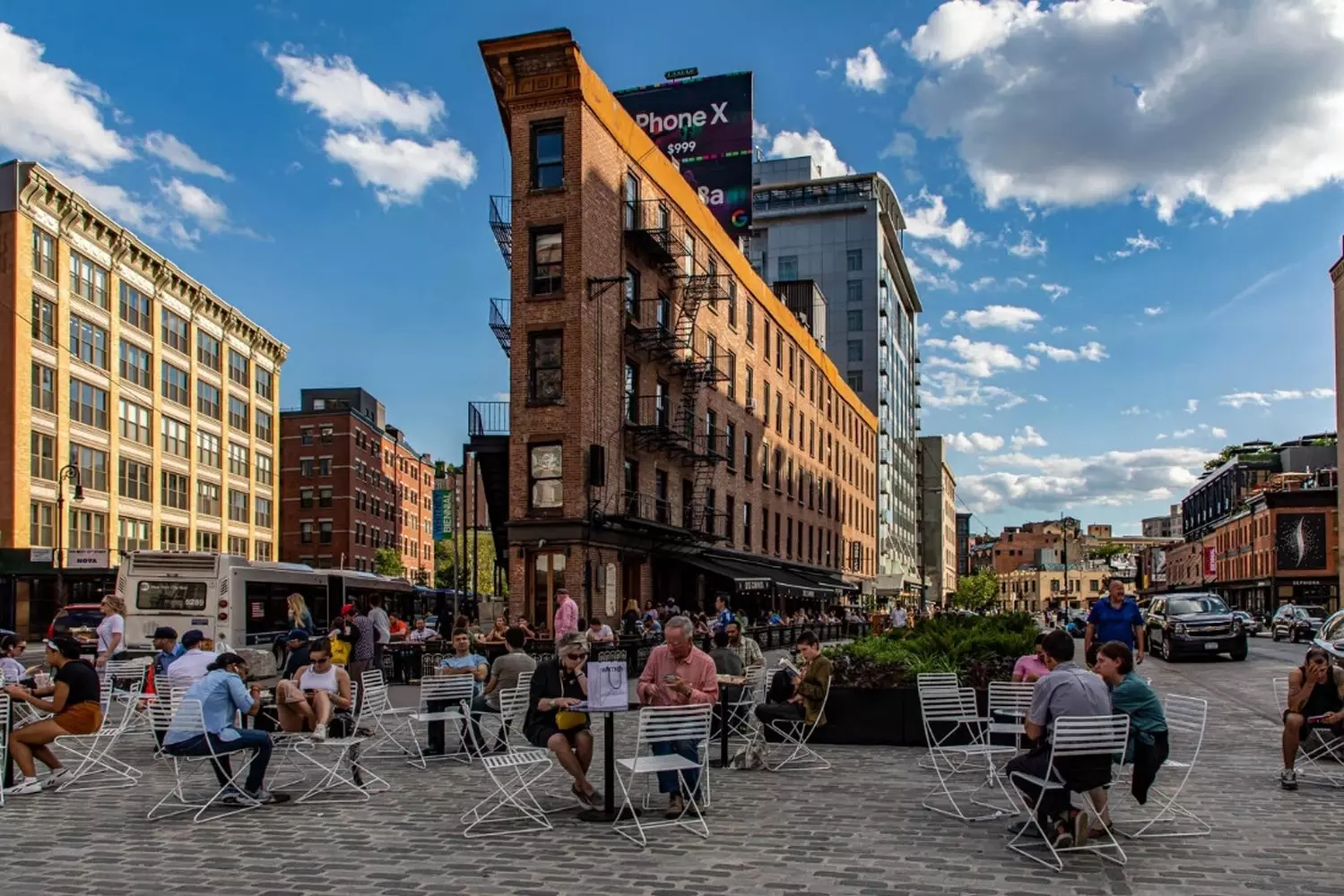 Discover the Unique Architecture of Triangular Buildings in the Meatpacking District, New York Discover a Triangular Corner Building with a Metal Awning in New York’s Meatpacking District