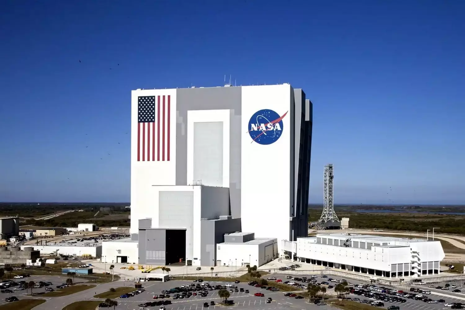 Houston, We Have a Landmark: NASA's Iconic Texas Campus The sprawling NASA Johnson Space Center complex in Houston, Texas, with its iconic Mission Control building and astronaut training facilities under clear blue skies