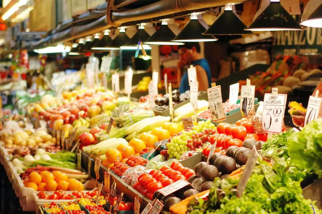 Vending vegetable counter at Pike Place Market — American Butler