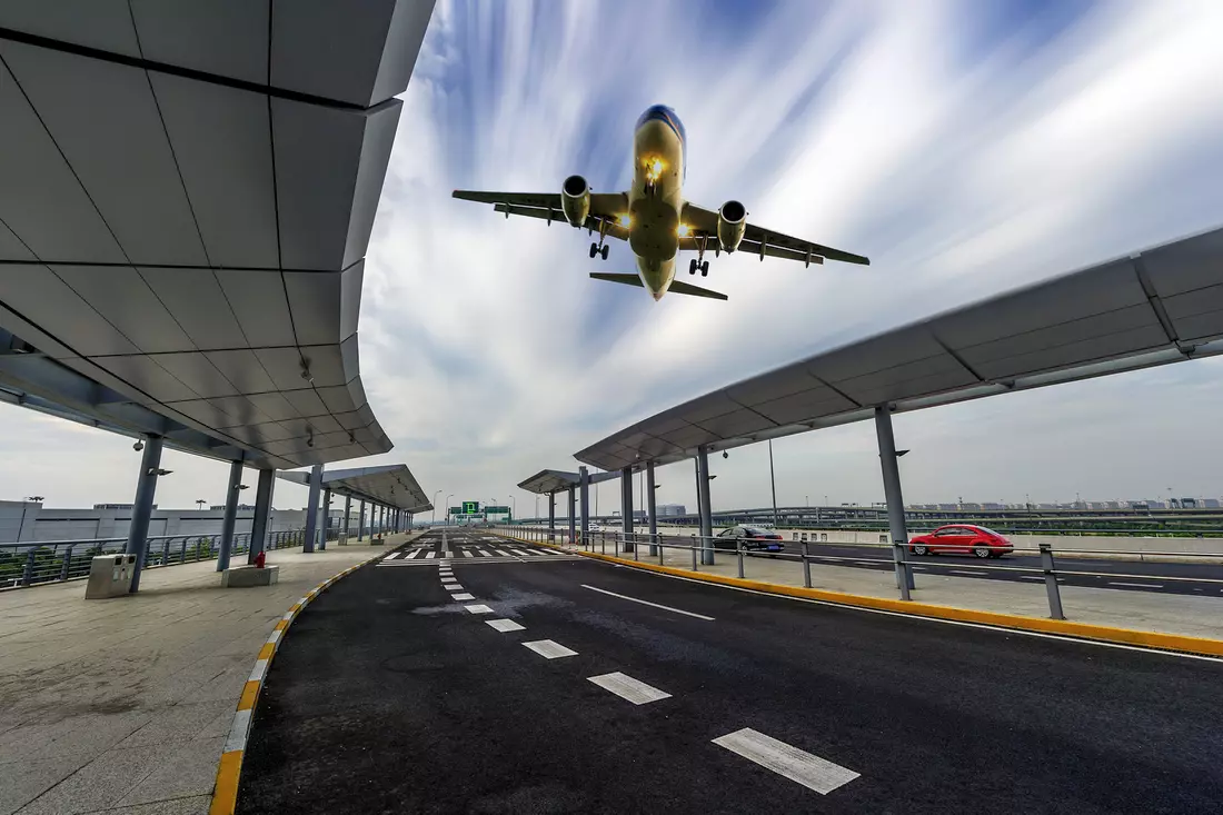 Photo of an airplane in the sky over the USA — booking air tickets when planning