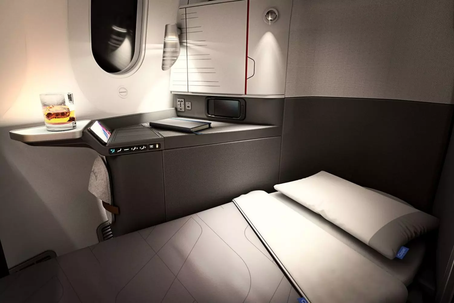 American Airlines Business Class cabin with lie-flat seats Spacious American Airlines Business Class seat converted into a comfortable bed during flight