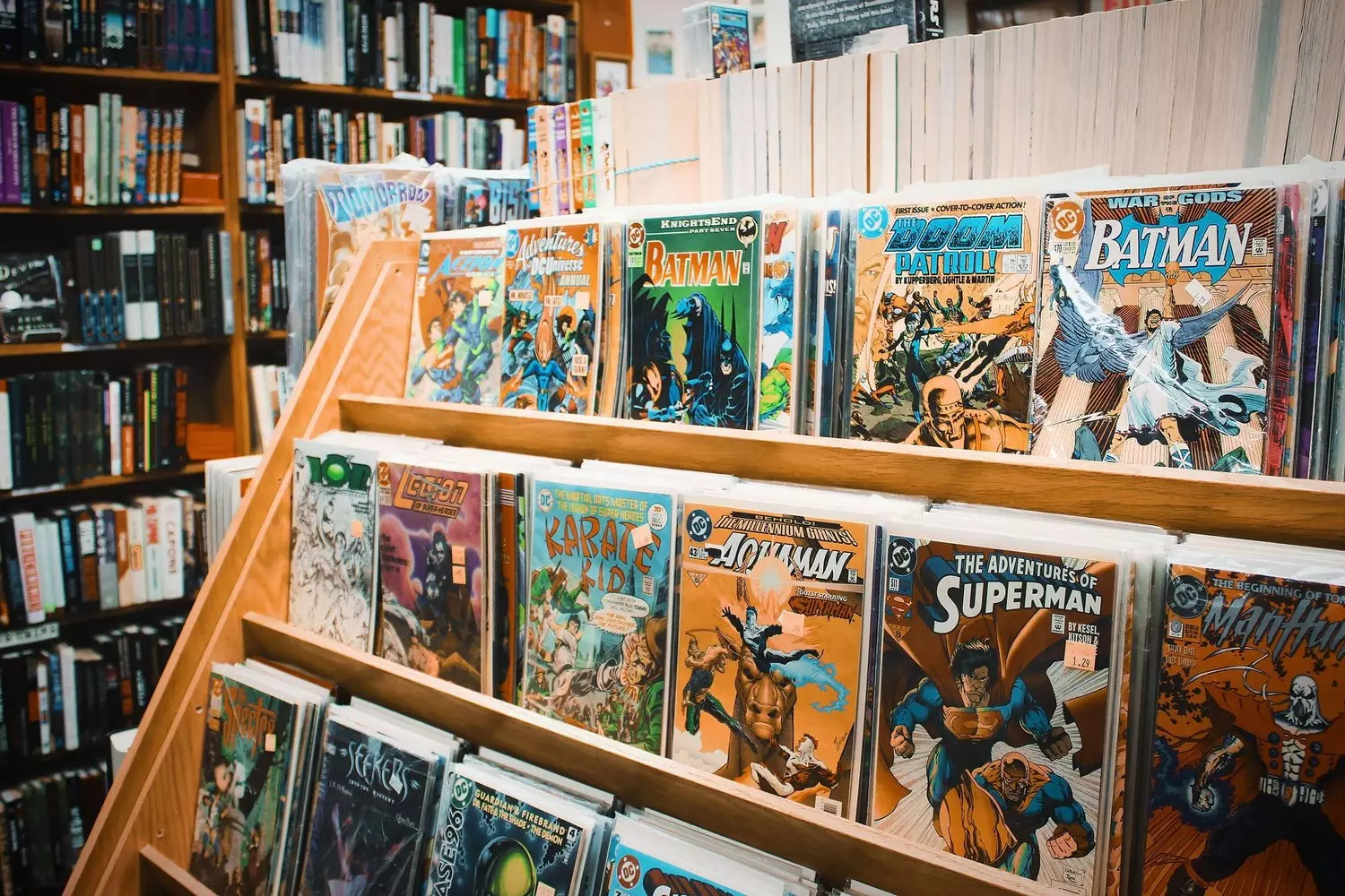 Comic Book Store: A Paradise for Collectors Interior of a specialized comic book store with floor-to-ceiling shelves filled with new issues, graphic novels, and collectibles