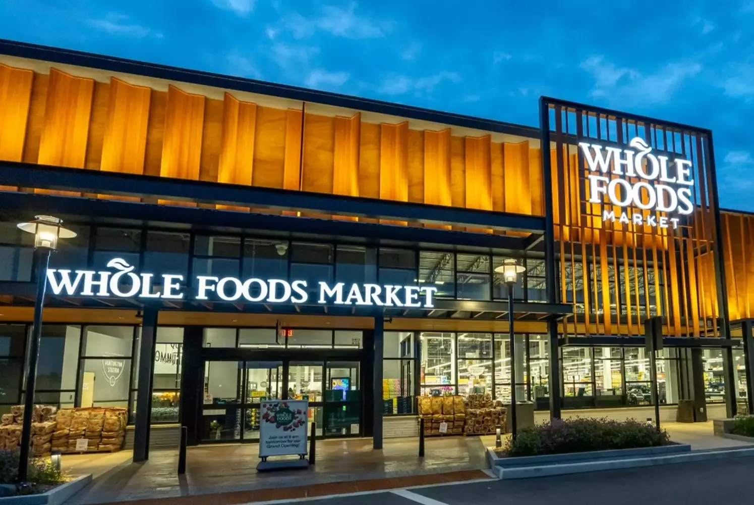Whole Foods Market USA: The Iconic Organic Grocery Store Exterior Exterior view of a Whole Foods Market store in the USA featuring the distinctive green signage, upscale facade with large windows, and shoppers entering the organic-focused supermarket