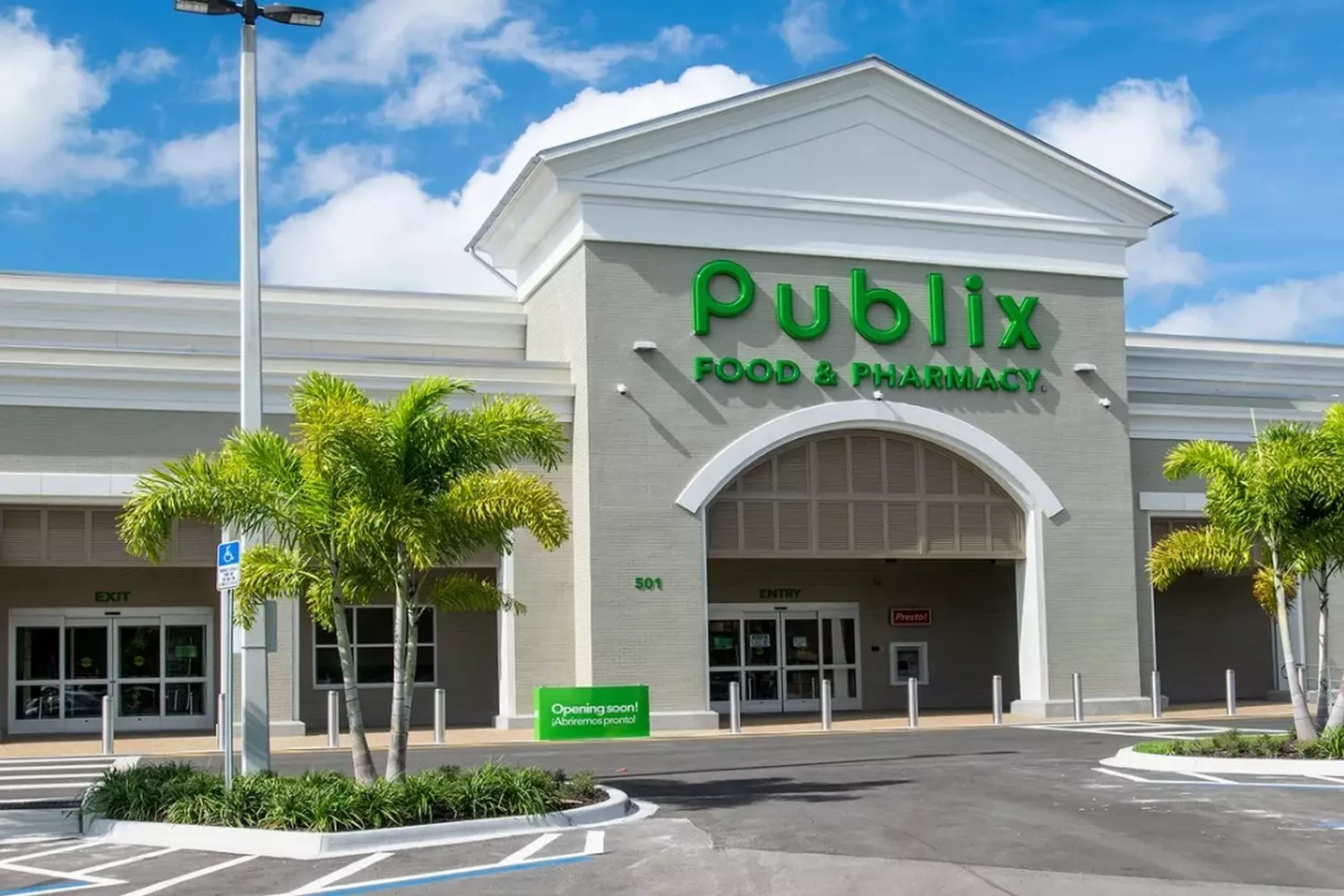 Publix Super Markets: The Face of Southern Grocery Excellence Exterior view of a classic Publix supermarket in the USA with the iconic green and white signage, well-maintained facade, and shoppers entering the sliding glass doors under the distinctive Publix logo