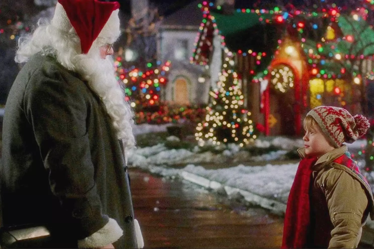 Home Alone Movie Still: Timeless US Christmas Nostalgia Still image from the American Christmas comedy 'Home Alone' featuring Macaulay Culkin as Kevin with his signature hands-on-cheeks pose or festive house decorations that became pop culture symbols
