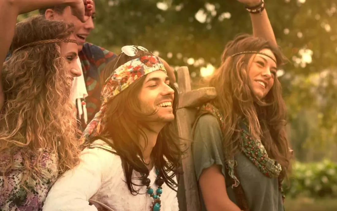 A group of hippies enjoy the sun and nature