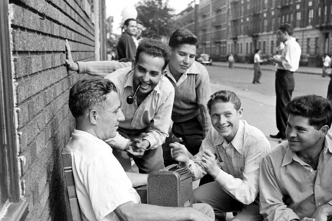 Forties hipsters chatting on the street