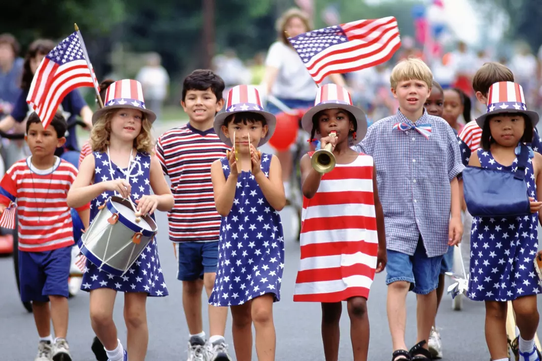 Children celebrating American culture in patriotic clothing representing US youth culture from the 1940s to 1970s