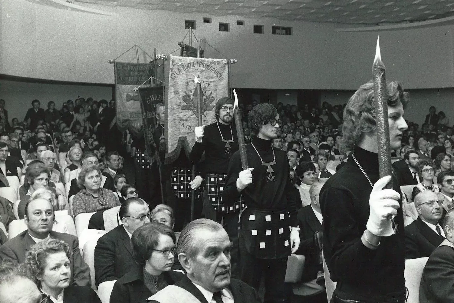 Members of the Masonic society at a meeting in ceremonial attire