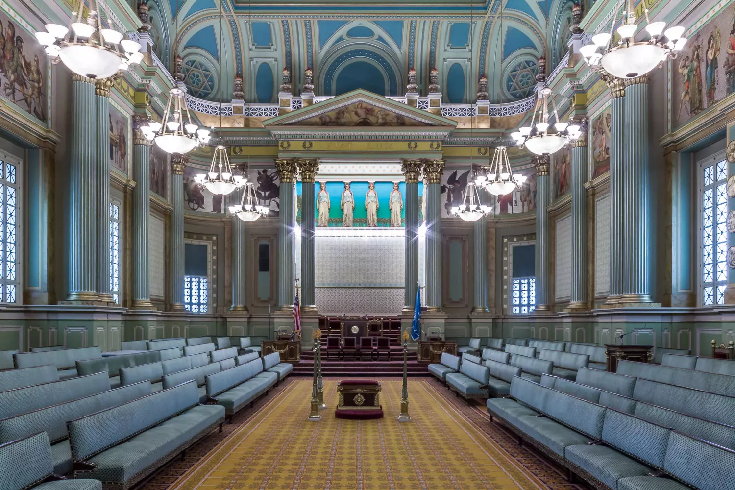 Interior of a Masonic lodge with symbols on the walls