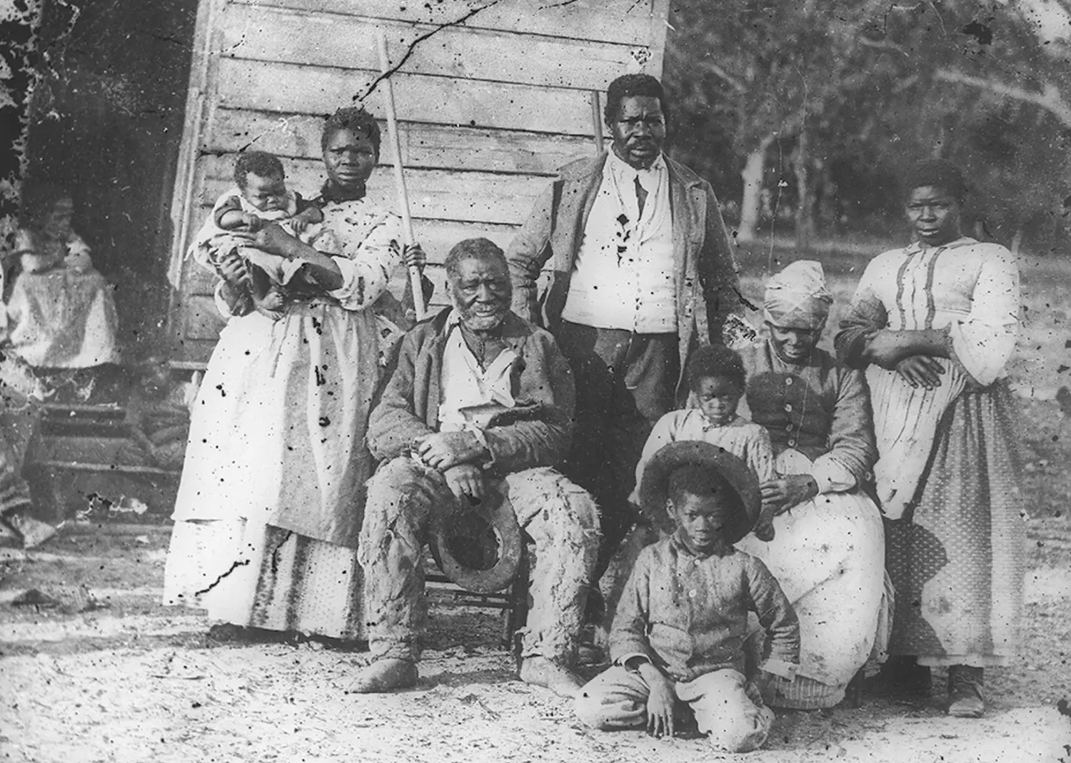 Enslaved African Americans at a plantation house in the USA — 19th-century illustration A group of enslaved African Americans in front of a house on a plantation in 19th-century USA, illustrating the harsh living conditions of slavery