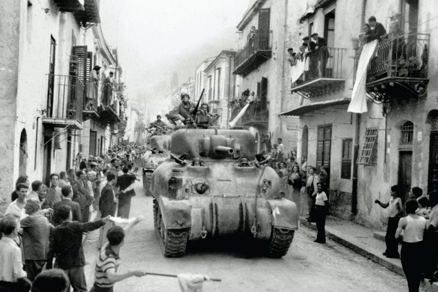 The Liberation of Palermo: Patton’s Armored Column, 1943 M4 Sherman tanks and U.S. troops parade through Palermo after its capture