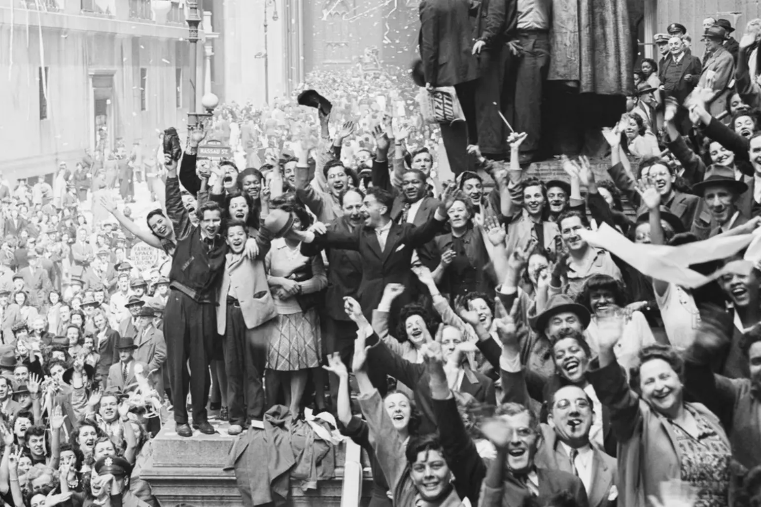 Victory Cheers: America Celebrates War's End in 1945 A massive crowd fills city streets during V-E or V-J Day celebrations