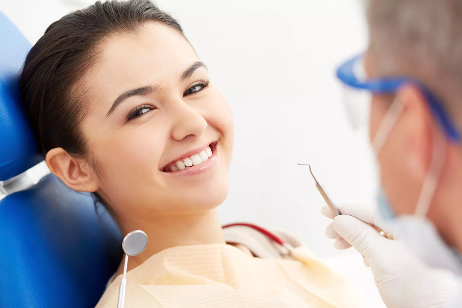 Dental treatment in the USA — photo of a happy girl cleaning teeth in America — American Butler