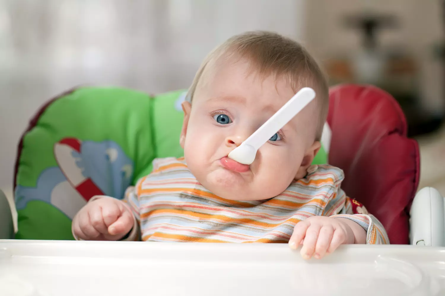 Stomatology in the USA — photo of a baby with a spoon in the mouth — American Butler