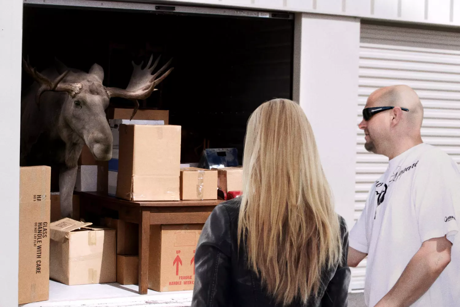 Scene from the 'Storage King' TV show: the hunt for hidden treasures Cast members from the Storage King reality TV show examining a storage locker's contents
