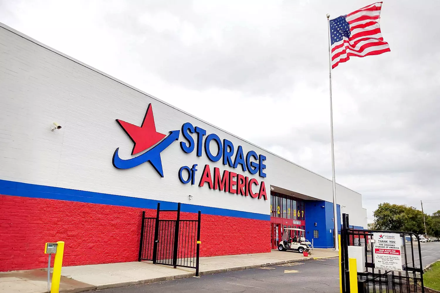 Storage of America facility: a national self-storage chain location in the USA Clean, modern facade of a Storage of America self-storage facility under a blue sky