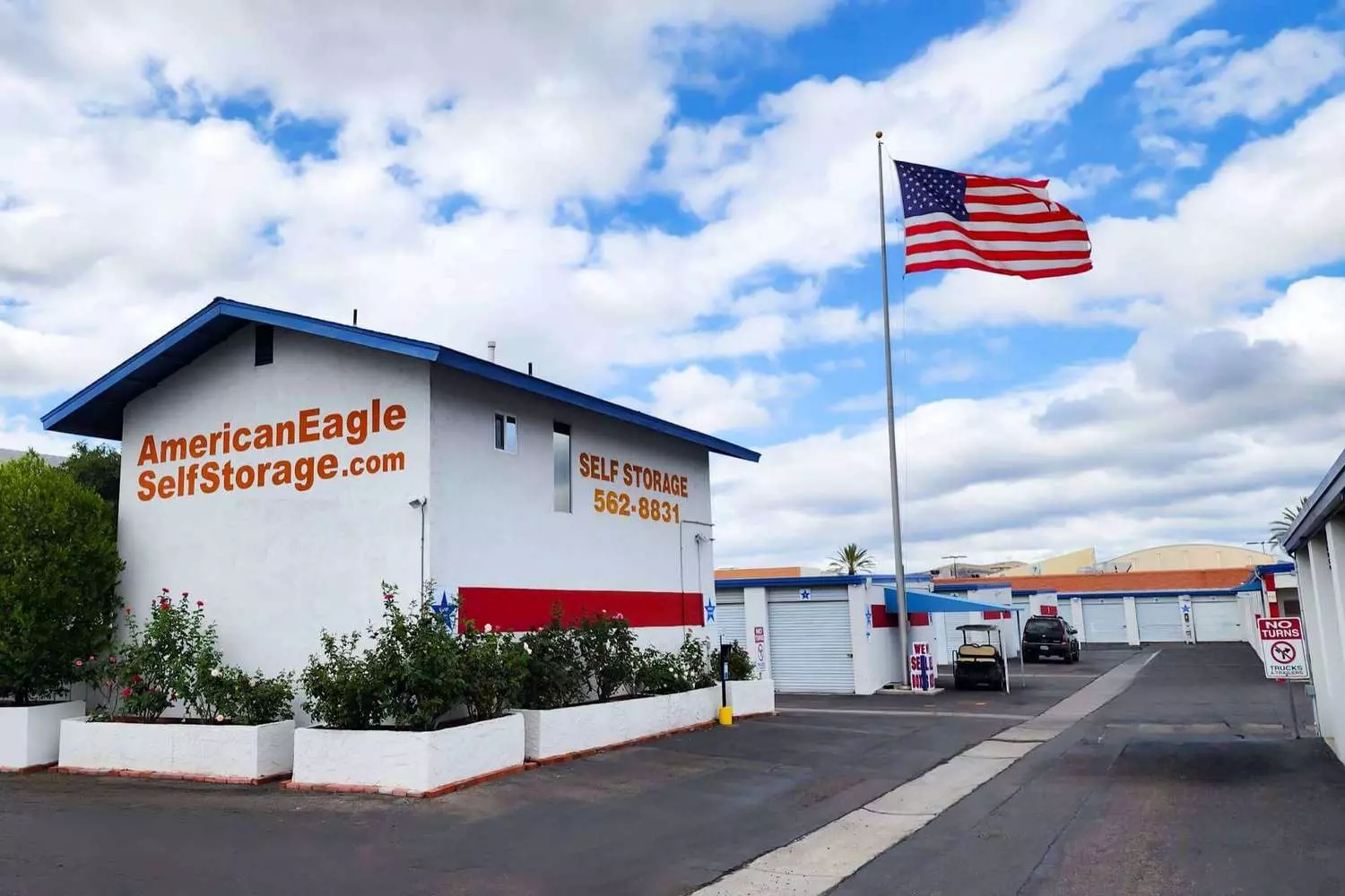 Renting a storage unit in the USA: secure and accessible lockers Corridor of storage unit sections with roll-up doors in a US storage facility