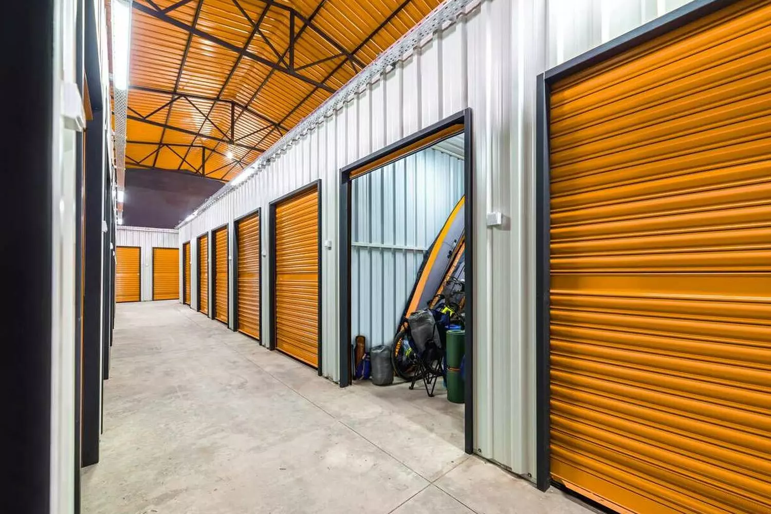 Typical interior of a self-storage facility in the USA: a hallway with individual units An interior hallway with individual rental storage lockers in America