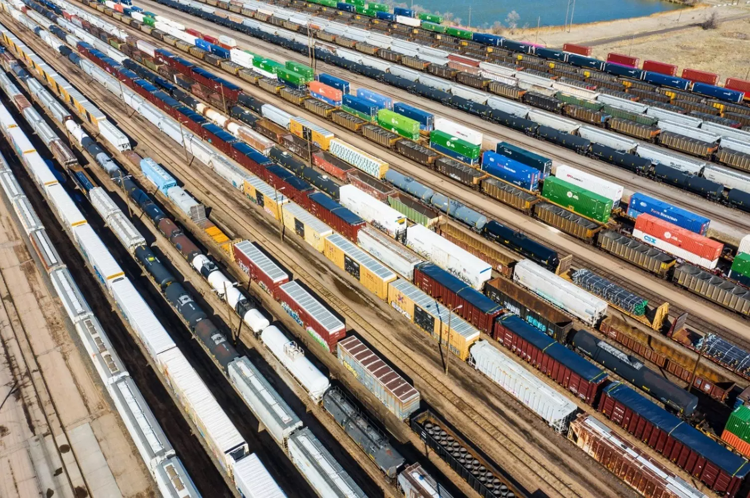 The Heart of Logistics: A Giant US Freight Rail Depot Inside a modern freight rail depot in the USA: maintenance and repair of powerful locomotives for companies like BNSF, Union Pacific, or CSX